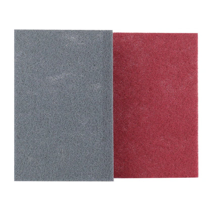 Two scuff pads, one gray and one red, on a white background